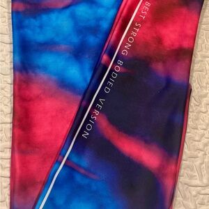 Vibrant leggings in a blue and pink gradient. One size fits most.
